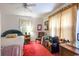 Cozy bedroom with red carpet, neutral walls, and ceiling fan at 404 13Th Ave. S, Myrtle Beach, SC 29577