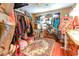 Walk-in closet with hardwood floors, hanging racks, and a patterned rug at 404 13Th Ave. S, Myrtle Beach, SC 29577