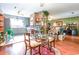 Eat-in kitchen with hardwood floors, brick column, and a glass top table at 404 13Th Ave. S, Myrtle Beach, SC 29577