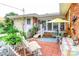 Outdoor patio area with comfortable seating and a table with umbrella at 404 13Th Ave. S, Myrtle Beach, SC 29577