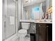 Bathroom with a shower and white tiling at 404 Snowy Egret Dr., Murrells Inlet, SC 29576