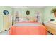 Charming bedroom with light green walls, a decorative wreath, and coordinated furniture at 404 Snowy Egret Dr., Murrells Inlet, SC 29576