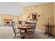 Dining area with a wooden table, chairs, mirror and sconces at 404 Snowy Egret Dr., Murrells Inlet, SC 29576