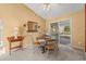 Dining area with sliding glass doors to backyard and view of ceiling fan at 404 Snowy Egret Dr., Murrells Inlet, SC 29576