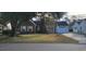 Charming brick home with an attached garage, mature trees, and a well-maintained lawn at 404 Snowy Egret Dr., Murrells Inlet, SC 29576