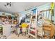 Cluttered garage featuring a ladder and shelving units, offering ample storage space at 404 Snowy Egret Dr., Murrells Inlet, SC 29576