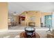 Open-concept living room with access to the kitchen and dining area; sliding doors to backyard at 404 Snowy Egret Dr., Murrells Inlet, SC 29576