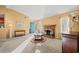 Bright and open living room with large windows, a fireplace, and lots of natural light at 404 Snowy Egret Dr., Murrells Inlet, SC 29576
