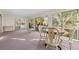 Bright sunroom with large windows providing ample natural light and scenic outdoor views at 404 Snowy Egret Dr., Murrells Inlet, SC 29576
