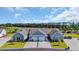 An aerial view of attractive homes with attached garages and manicured lawns set amidst a lush, green landscape at 4053 Taranto Loop # C, Myrtle Beach, SC 29579