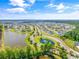 Aerial view of the community, showcasing beautiful ponds, landscaping, and well-maintained homes at 4053 Taranto Loop # C, Myrtle Beach, SC 29579