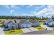 An aerial view of gray-colored homes with well-maintained lawns and private driveways in a peaceful community at 4053 Taranto Loop # C, Myrtle Beach, SC 29579