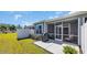Back patio offers a grill for outdoor cooking, along with a lawn and a privacy fence at 4053 Taranto Loop # C, Myrtle Beach, SC 29579