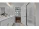 Well-lit bathroom features a double sink vanity with white cabinets and a stand-up shower with glass door at 4053 Taranto Loop # C, Myrtle Beach, SC 29579