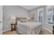 Cozy bedroom features a large window and a tufted headboard, creating a comfortable atmosphere at 4053 Taranto Loop # C, Myrtle Beach, SC 29579