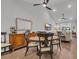 Open dining area with wood floors, vaulted ceiling, a wood table with seating and sideboard storage at 4053 Taranto Loop # C, Myrtle Beach, SC 29579
