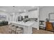 Bright kitchen featuring white cabinets, stainless appliances, large island, and modern pendant lighting at 4053 Taranto Loop # C, Myrtle Beach, SC 29579