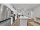 Bright, open kitchen with stainless steel appliances, a large island, and seamless flow to the living area at 4053 Taranto Loop # C, Myrtle Beach, SC 29579