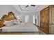 Spacious bedroom boasts a decorative bed frame and an oversized armoire for storing clothes at 4053 Taranto Loop # C, Myrtle Beach, SC 29579