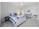 Comfortable bedroom featuring blue accents, a ceiling fan, and plenty of natural light at 4449 Honir Dr., Myrtle Beach, SC 29579