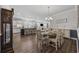 Open floor plan showcases a dining area with a table set for six near the kitchen and living space at 4449 Honir Dr., Myrtle Beach, SC 29579