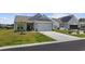 Well-maintained single story home with an attached two-car garage and front lawn with minimal landscaping at 4449 Honir Dr., Myrtle Beach, SC 29579