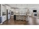 Modern kitchen features a large island, stainless steel appliances, and an open layout to the living area at 4449 Honir Dr., Myrtle Beach, SC 29579