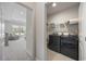Well-lit laundry room with modern appliances including a washer and dryer at 4449 Honir Dr., Myrtle Beach, SC 29579