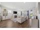 Bright, open living room with a fireplace, ample seating, hardwood floors and view of the backyard at 4449 Honir Dr., Myrtle Beach, SC 29579