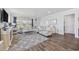 Bright and spacious living room with fireplace, neutral decor, hardwood floors, and large windows at 4449 Honir Dr., Myrtle Beach, SC 29579