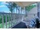 Covered balcony features comfortable seating and tranquil views at 4486 Little River Inn Ln. # 2107, Little River, SC 29566