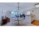 Inviting dining area featuring a glass-topped table, seating for four, and ample natural light at 4486 Little River Inn Ln. # 2107, Little River, SC 29566