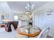 Cozy dining area with glass-top table and access to kitchen and living room at 4486 Little River Inn Ln. # 2107, Little River, SC 29566