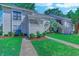 Inviting condo exterior with manicured lawn, showcasing well-maintained landscaping and a pleasant residential setting at 4486 Little River Inn Ln. # 2107, Little River, SC 29566