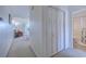 Bright hallway leading to dining area and bathroom, with ample storage provided by the large closet at 4486 Little River Inn Ln. # 2107, Little River, SC 29566