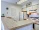 Functional kitchen with white appliances, light wood countertops and tiled backsplash at 4486 Little River Inn Ln. # 2107, Little River, SC 29566