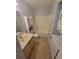 A compact bathroom with a shower, a modern sink, and a convenient washer/dryer combo at 477 White River Dr. # 32-H, Myrtle Beach, SC 29579
