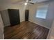 A bright bedroom with wood flooring, a ceiling fan and closet space at 477 White River Dr. # 32-H, Myrtle Beach, SC 29579