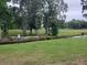Scenic view of the lush green golf course with mature trees and a small creek at 477 White River Dr. # 32-H, Myrtle Beach, SC 29579