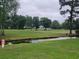 View of the golf course with a creek and lush green landscape at 477 White River Dr. # 32-H, Myrtle Beach, SC 29579