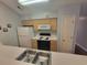 Well-lit kitchen with modern appliances and lots of countertop space at 477 White River Dr. # 32-H, Myrtle Beach, SC 29579