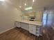 Open kitchen with wooden cabinets, breakfast bar, and modern appliances at 477 White River Dr. # 32-H, Myrtle Beach, SC 29579