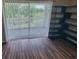 Living room with sliding glass door and beautiful nature view at 477 White River Dr. # 32-H, Myrtle Beach, SC 29579