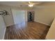 Bright living room featuring hardwood flooring and sliding glass door access to patio at 477 White River Dr. # 32-H, Myrtle Beach, SC 29579
