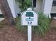 Community sign displaying the property number 32 amidst landscaping at 477 White River Dr. # 32-H, Myrtle Beach, SC 29579