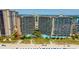 Aerial view showcasing a beachfront resort with multiple buildings, a pool area, and direct beach access at 4800 S Ocean Blvd. # 504, North Myrtle Beach, SC 29582