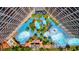 Overhead aerial view of large pools surrounded by palm trees between condo towers at 4800 S Ocean Blvd. # 504, North Myrtle Beach, SC 29582