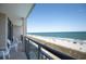 Balcony view features ocean, beach and lounge chairs at 4800 S Ocean Blvd. # 504, North Myrtle Beach, SC 29582