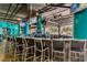 Indoor bar area featuring seating, TVs, and a wide selection of alcohol and beverages at 4800 S Ocean Blvd. # 504, North Myrtle Beach, SC 29582