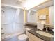 Well-lit bathroom with a shower and bath combination and granite countertop at 4800 S Ocean Blvd. # 504, North Myrtle Beach, SC 29582